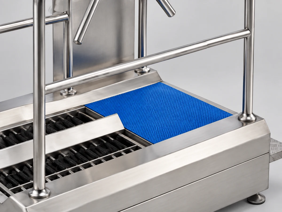 Blue moisture-removal mat in the stainless steel frame of the DSE-B hygiene station
