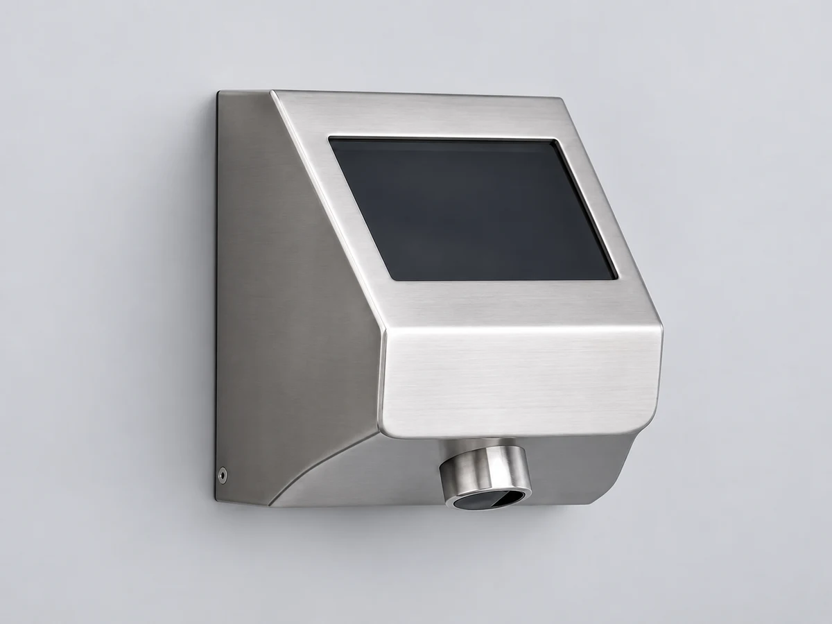 A stainless steel liquid soap dispenser with a sensor window and lower outlet