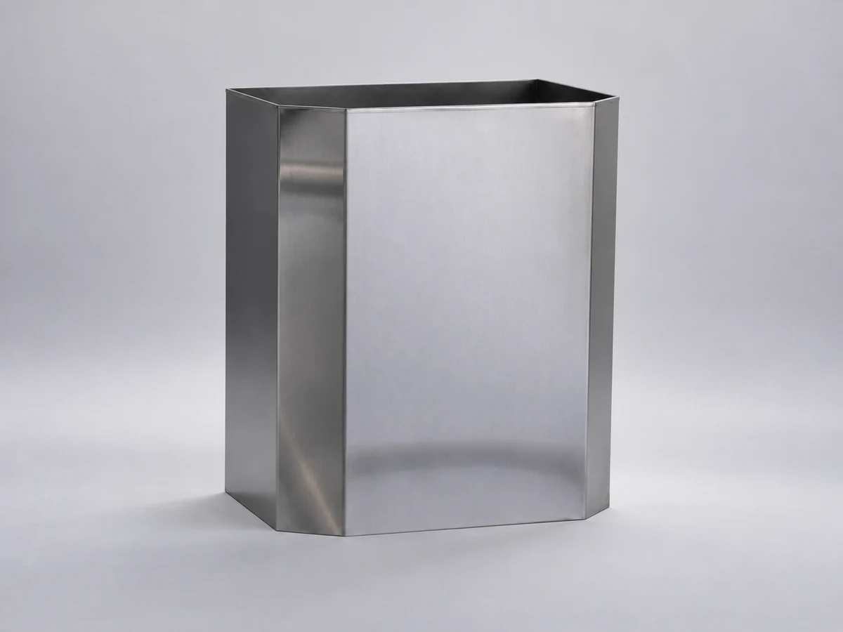 An open-top rectangular stainless steel waste bin