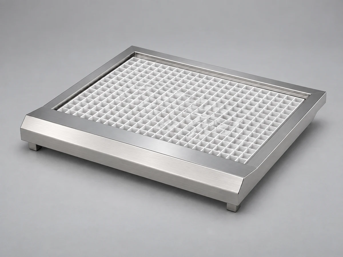 A disinfectant footbath with a white grate for HGE-M1